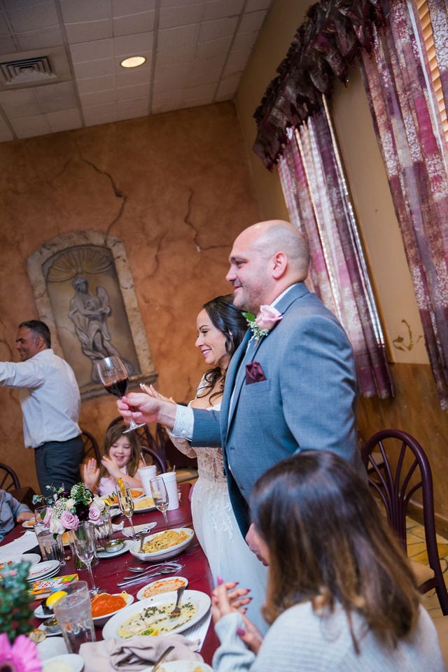 April's San Antonio at the wedding toasts bride and groom