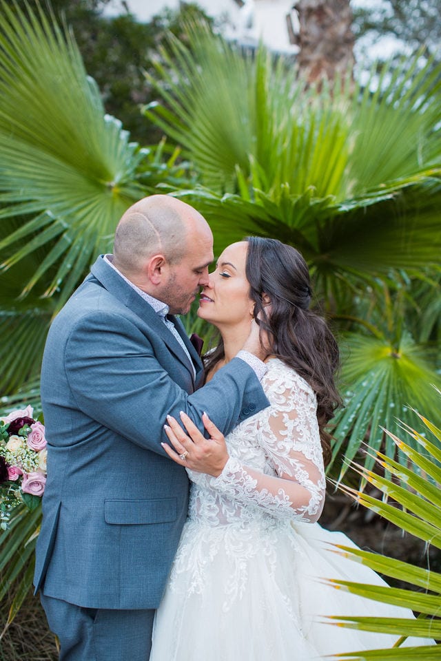 April's San Antonio at the wedding kiss by palms