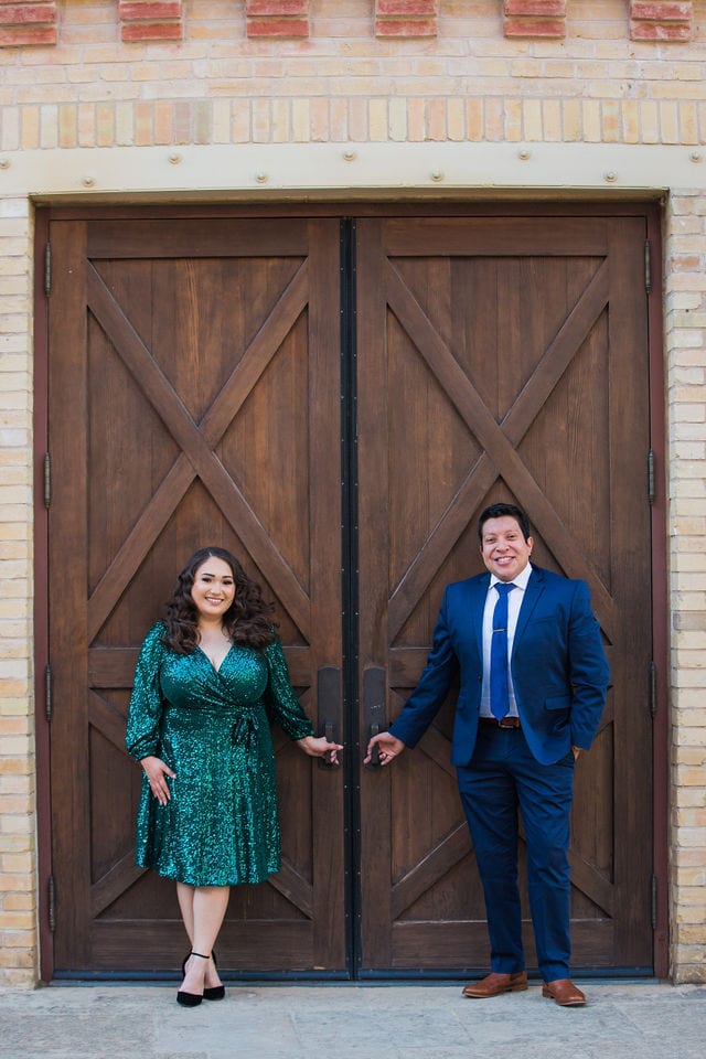 Chloe engagement at the Pearl leaning on the Stable doors