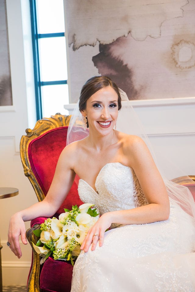 Mary kate bridal at Red Berry Estate on red sofa
