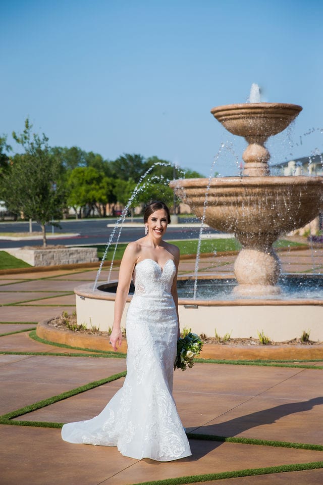 Mary kate bridal at Red Berry Estate in front of the fountain