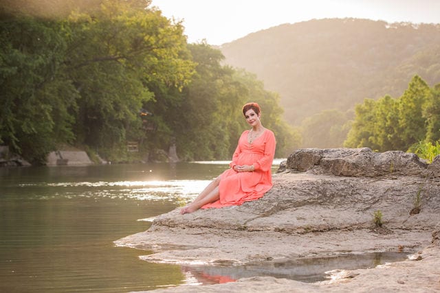 Monique's Maternity session sitting on the rock in the river