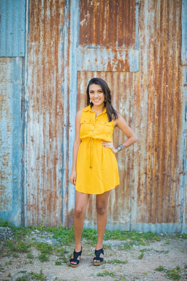 Aubree's Senior session in Gruene portrait by rusted wall