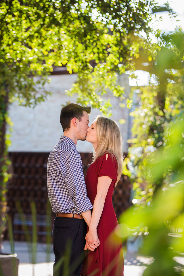 Emily's San Antonio engagement at the Pearl courtyard kiss