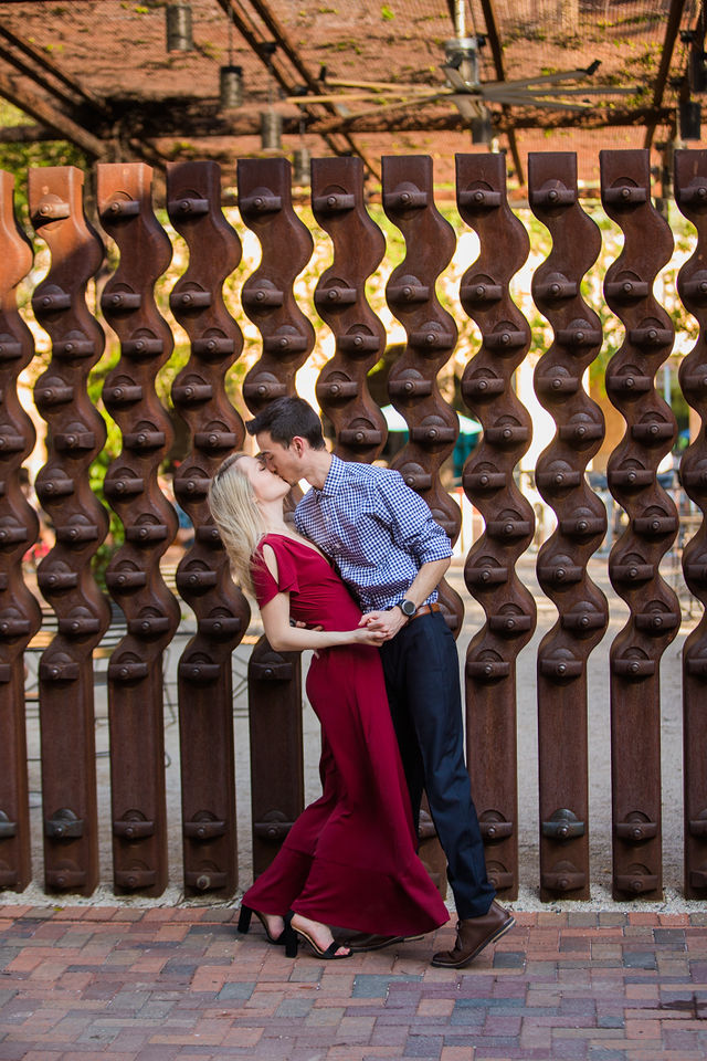 Emily's San Antonio engagement at the Pearl courtyard sculpture kiss