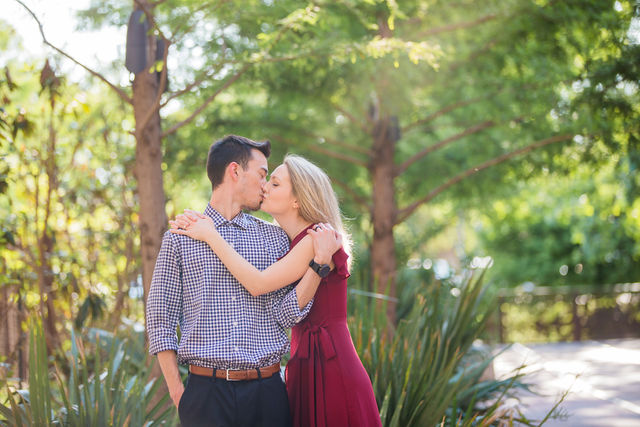 Emily's San Antonio engagement at the Pearl breezeway kiss in the sun