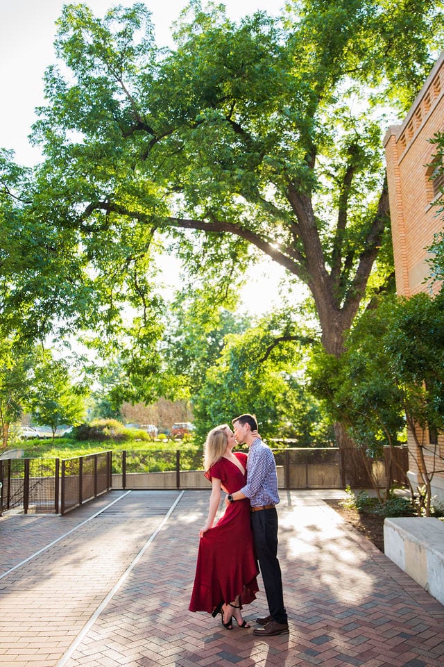 Emily's San Antonio engagement at the Pearl sun though the trees kiss
