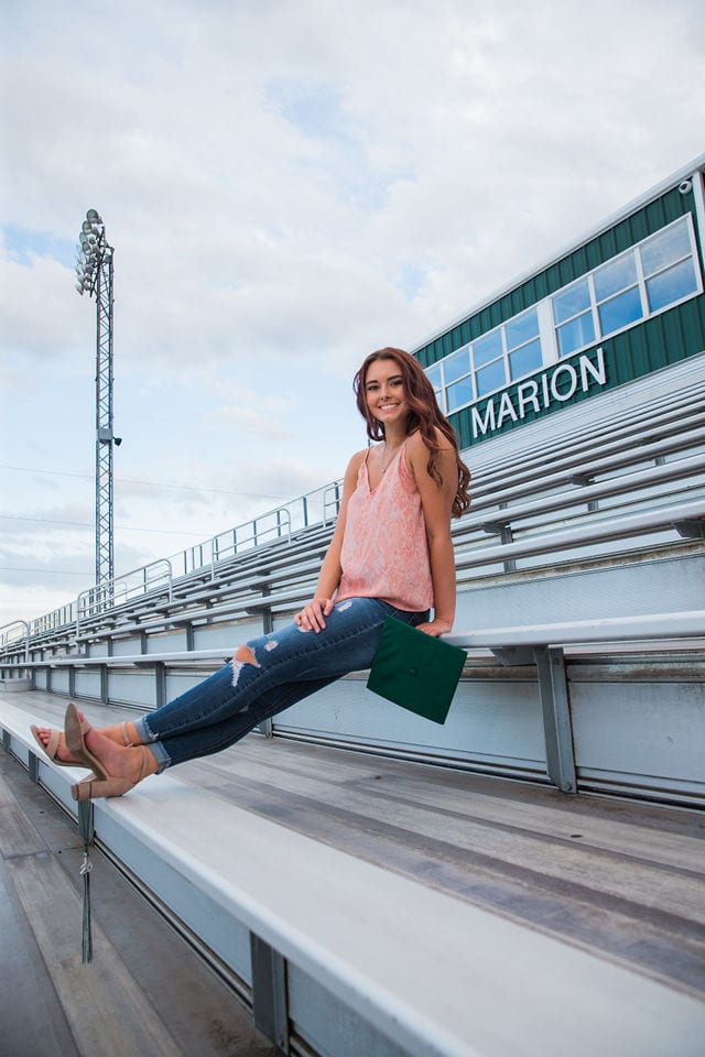 Faith Senior session in Marion wearing tassel on shoes with bandstand