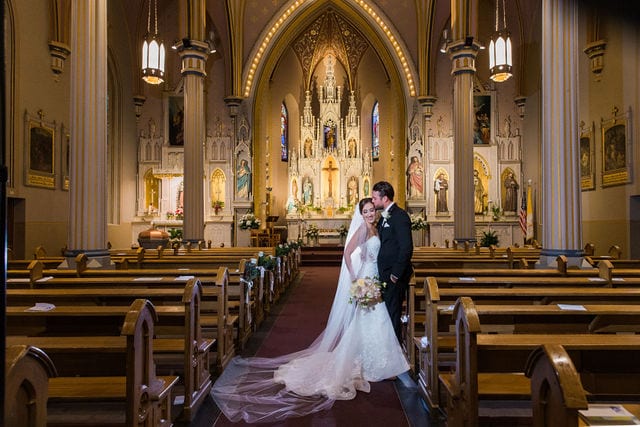 Spenser wedding San Antonio Saint Joesph kiss portrait on the aisle