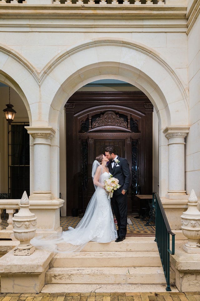 Spenser wedding San Antonio villa Finale kiss portrait on the steps