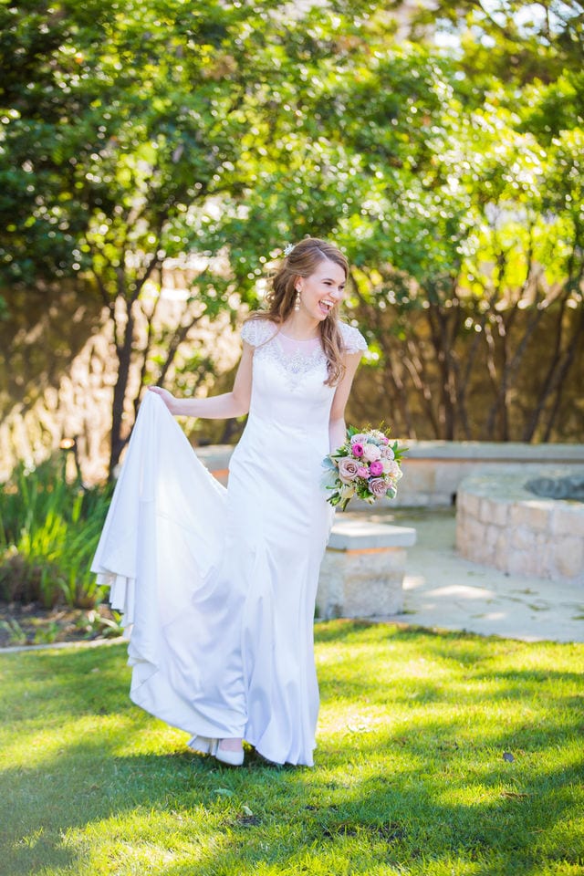 Olivia bridal at southwest school of Art bride walking and laughing