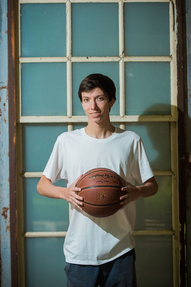 Wyatt's senior session the Pearl in the window with basketball