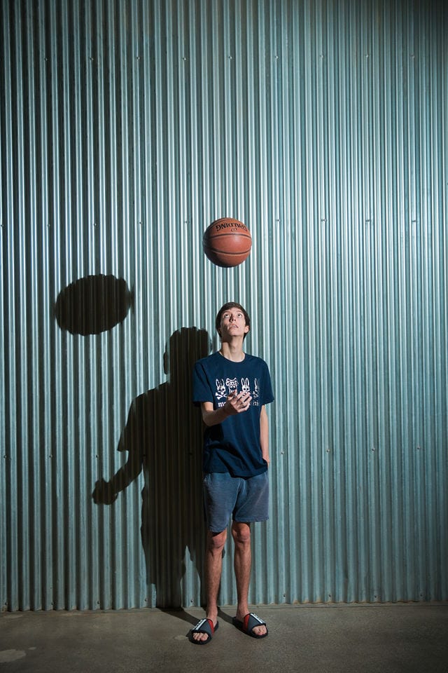 Wyatt's senior session the Pearl yin wall with basketball