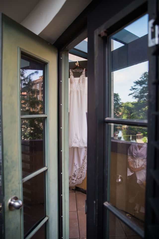 Anne wedding the Valencia bride's gown hanging on the balcony
