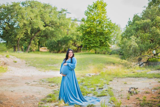 Emilia maternity session Kendall Pointe in the creek holding belly