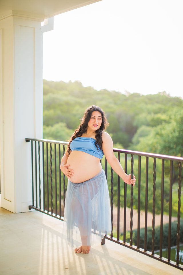 Emilia maternity session Kendall Pointe on the porch by railing
