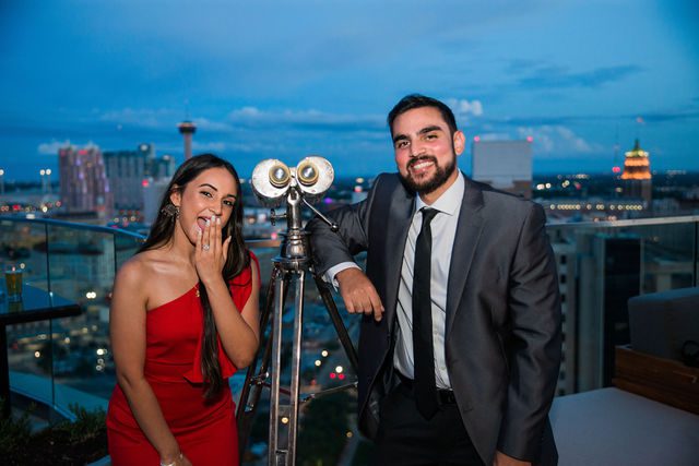 Kunal proposal at the Thompson Hotel excited portrait on the rooftop