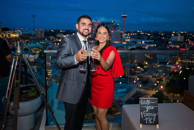 Kunal proposal at the Thompson Hotel toast with the champagne