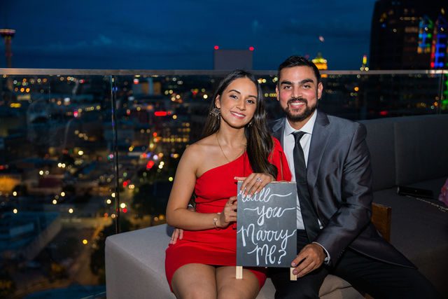 Kunal proposal at the Thompson Hotel sign on The Moon’s Daughters Rooftop