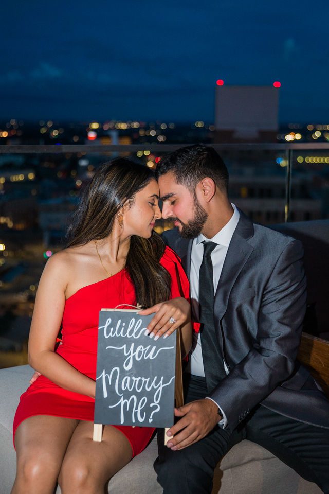 Kunal proposal at the Thompson Hotel foreheads touching The Moon’s Daughters Rooftop