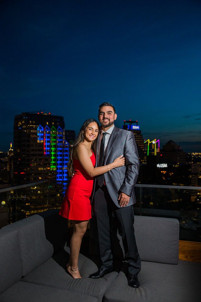 Kunal proposal at the Thompson Hotel standing on the sofa The Moon’s Daughters Rooftop