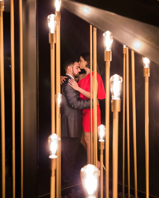 Kunal proposal at the Thompson couple portrait in the lobby with lights