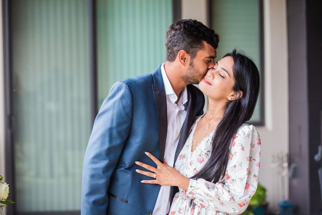 Rishi and Sahis San Antonio proposal cheek kiss on porch