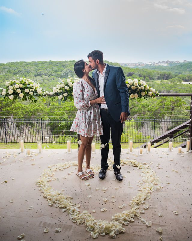 Rishi and Sahis San Antonio proposal kiss on porch in the heart