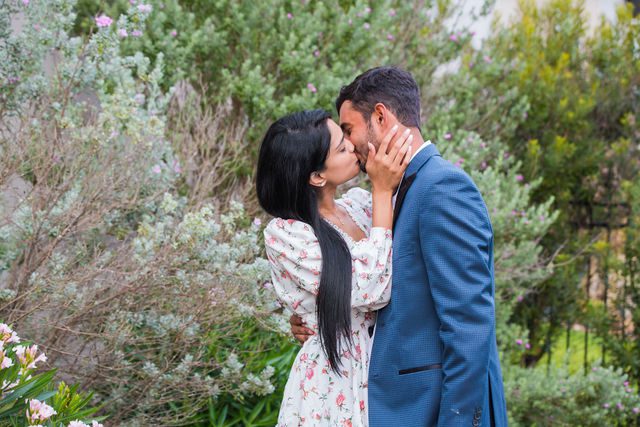 Rishi and Sahis San Antonio proposal couple portrait her kissing him