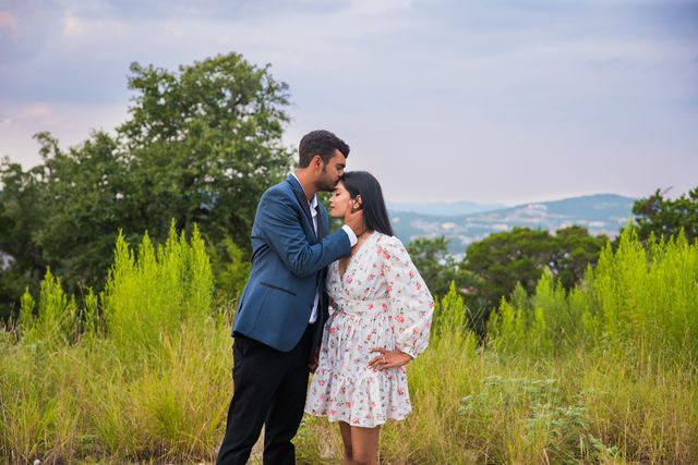 Rishi and Sahis San Antonio proposal on top of the hill forehead kiss