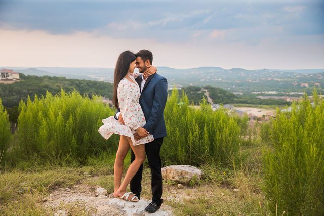 Rishi and Sahis San Antonio proposal on top of the hill wind blowing skirt
