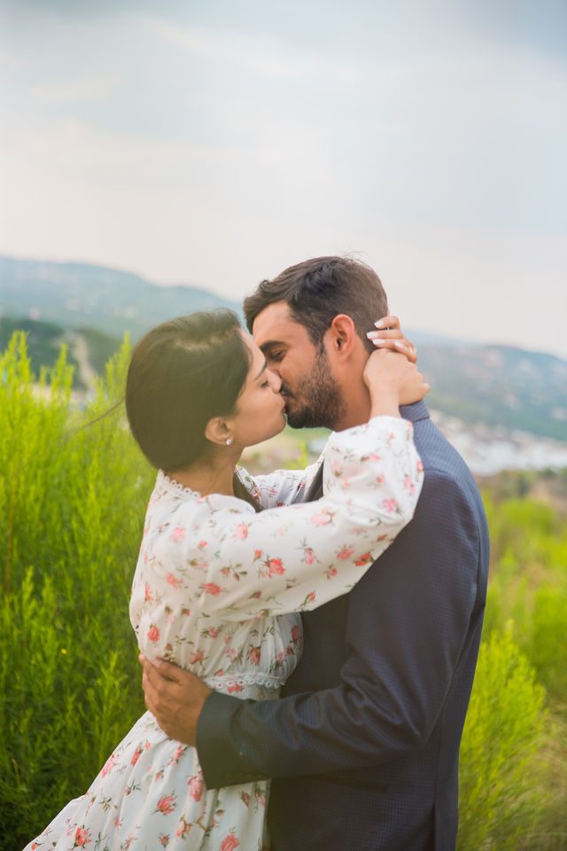 Rishi and Sahis San Antonio proposal engagement kissing on the hill