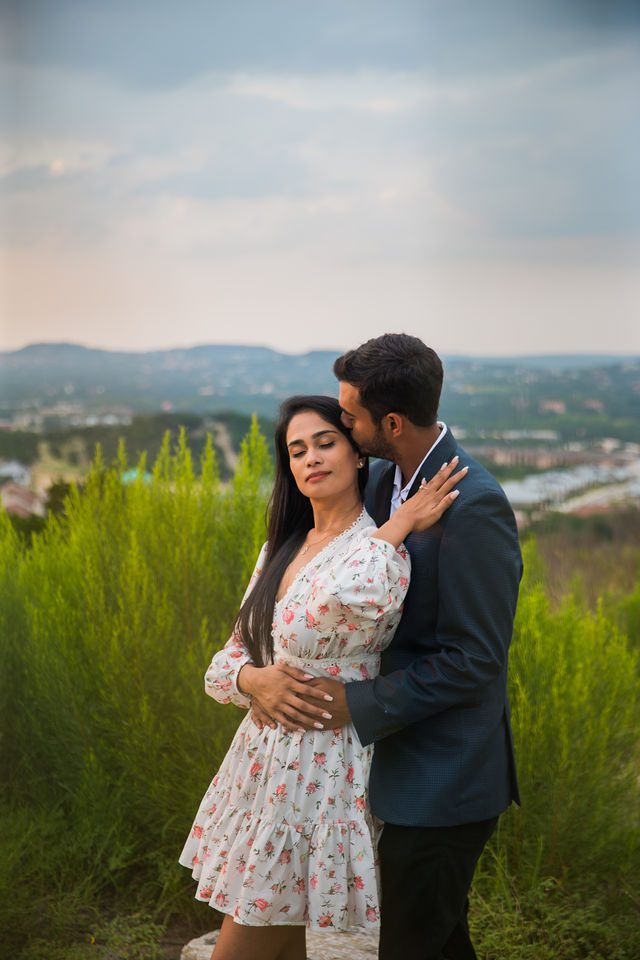Rishi and Sahis San Antonio proposal engagement head kiss on the hill
