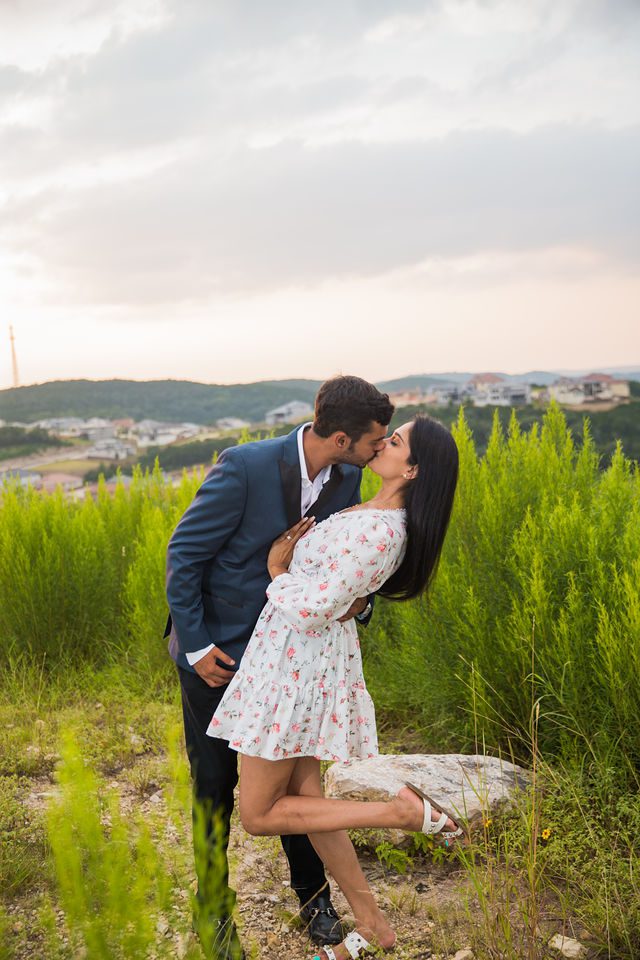 Rishi and Sahis San Antonio proposal engagement dip kissing on the hill