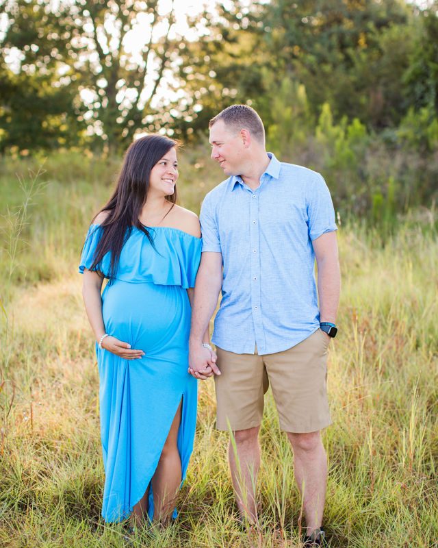 Stefan maternity Cibolo Natural Area couple in the grass holding hands