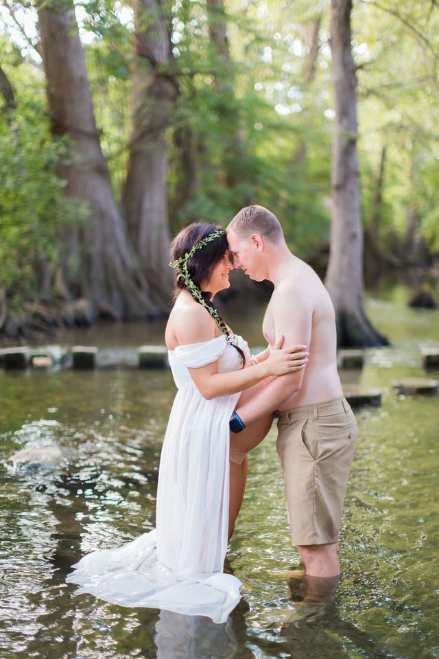 Stefan maternity Cibolo Natural Area couple in the water foreheads touching