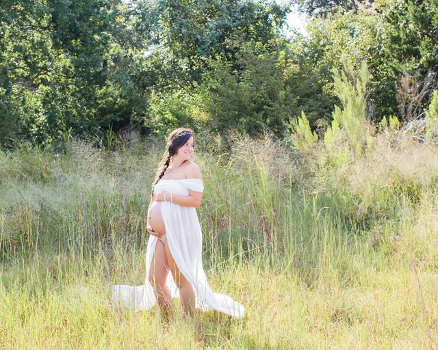 Stefan maternity Cibolo Natural Area Ashley in white in the grass