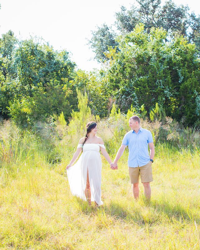 Stefan maternity Cibolo Natural Area couple in white in the grass walking