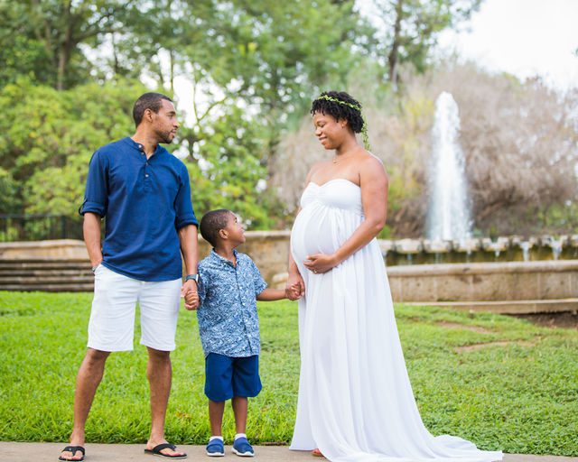 Shara maternity McNay Art Museum white gown family by the fountain