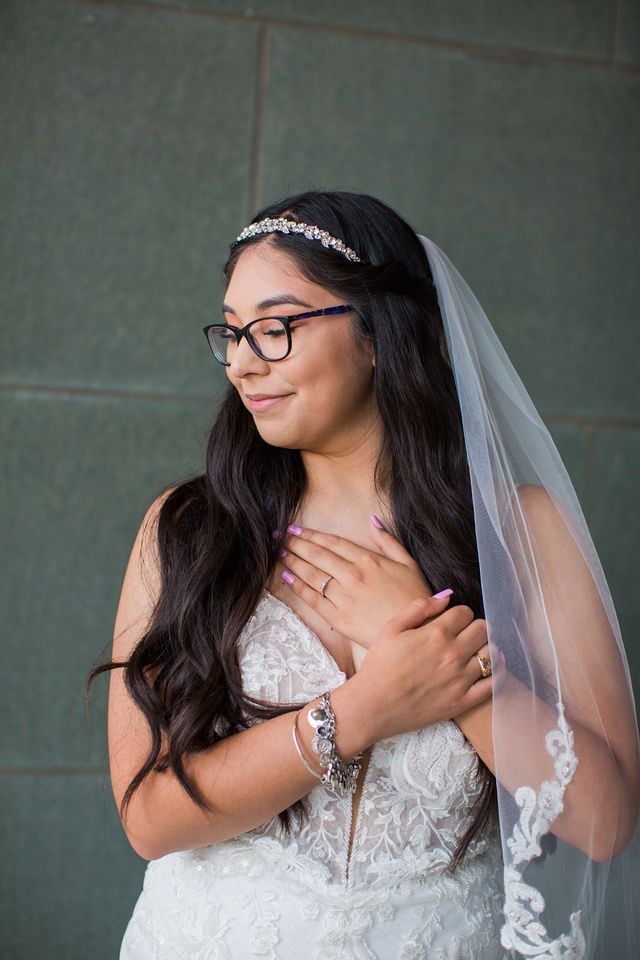 Bethany's bridal portrait at the McNay holding hands