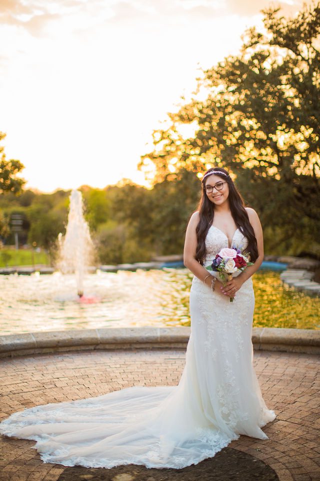 Bethany's bridal portrait the McNay fountain at sunset under veil