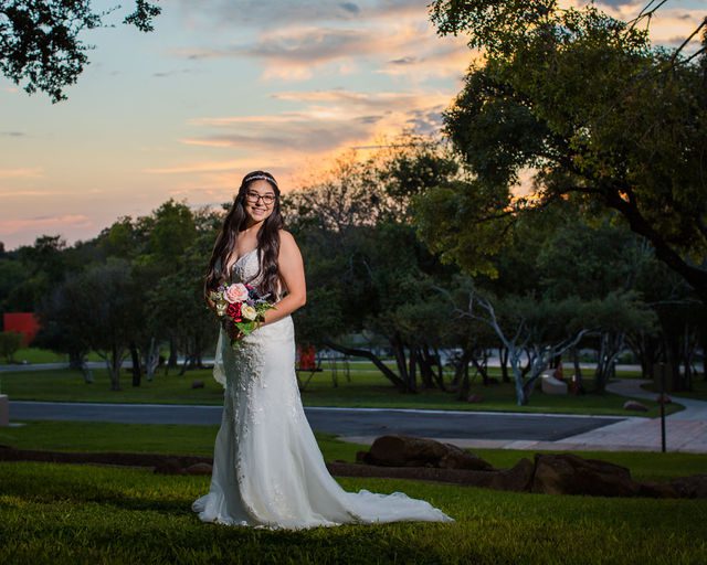 Bethany's bridal portrait the McNay in the grass at sunset