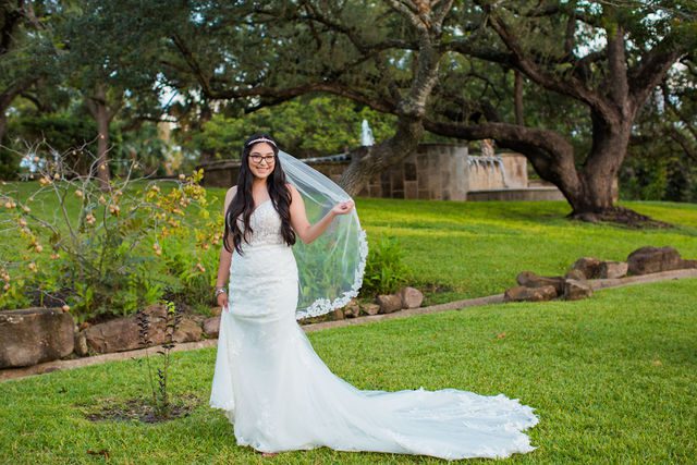 Bethany's bridal portrait the McNay in the grass
