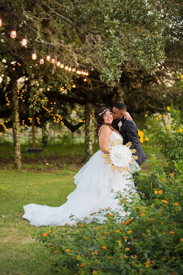 Mayra's wedding snuggling portrait in the vines at Oak Valley Vineyards