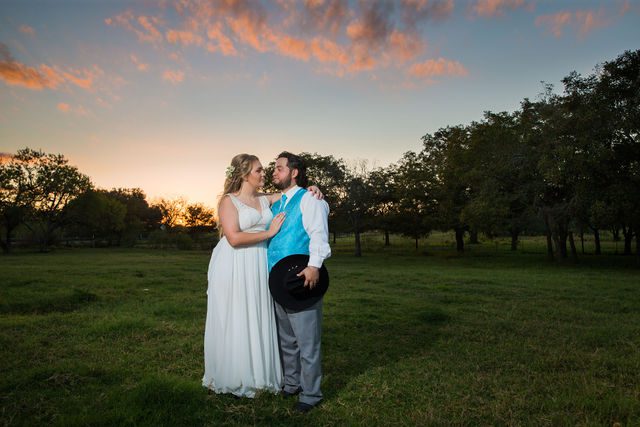 Ashley and Andy's sunset portrait at wedding at the Copper Door