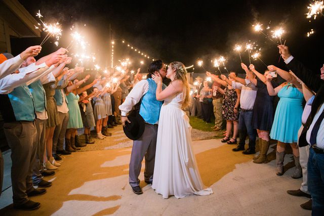 Ashley's wedding reception sparkler exit kiss at the Copper Door