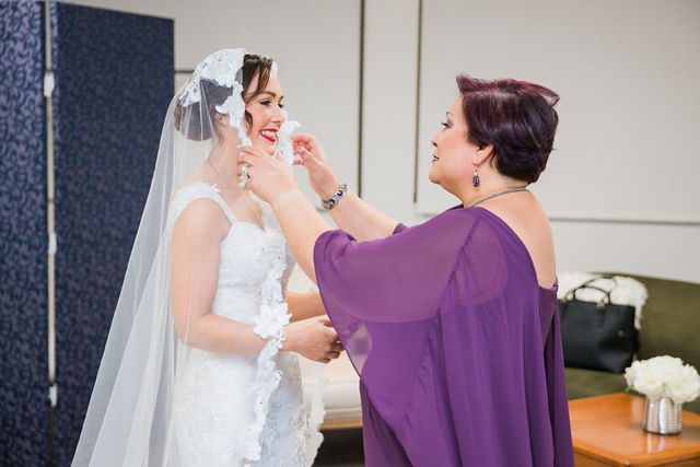 Alex's mom fixing veil before the wedding San Fernando Cathedral