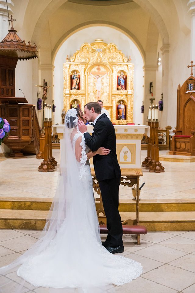 Jacob and Alex's wedding kiss at San Fernando Cathedral