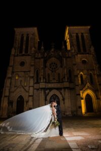 Jacob's wedding kiss with veil outside the San Fernando Cathedral