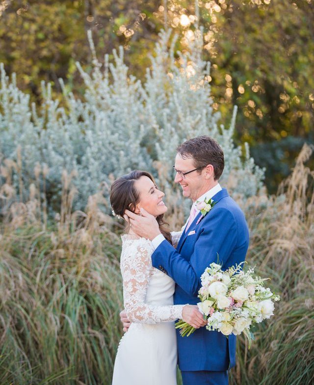 Ann and Jud's wedding portrait, Kendall Inn in Boerne in the sun by the pampas grass